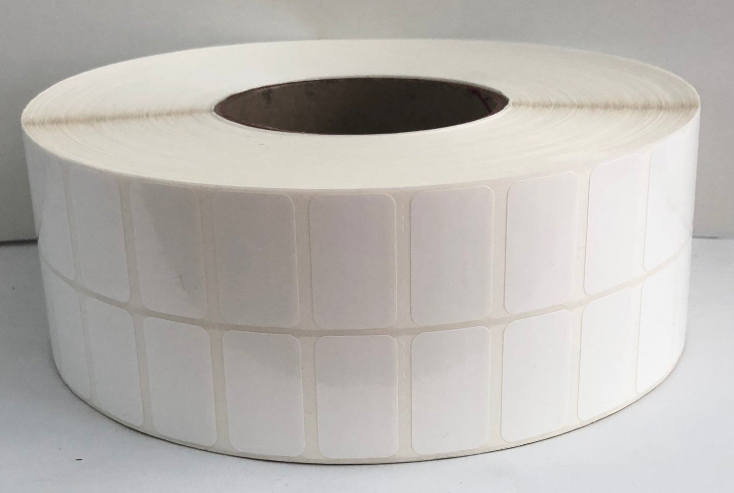 etiquettes-rive-sud,Étiquettes 1.25" X 0.75" polypro transfert thermique en rouleau sur core 3"